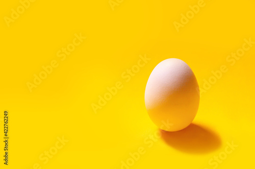 Easter. Natural healthy food and organic farming concept.Pattern from chicken eggs on yellow background. Creative food minimalistic background, 