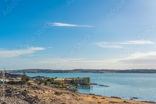 Landscape over L  deritz overlooking a tranquil sea in the rugged  rocky terrain of Luderitz  Namibia.