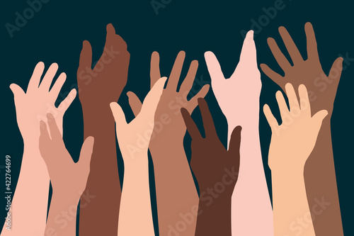 Concept de la fraternité humaine, avec des silhouettes de mains levées de différentes ethnies, pour symboliser la diversité et la lutte contre le racisme. photo