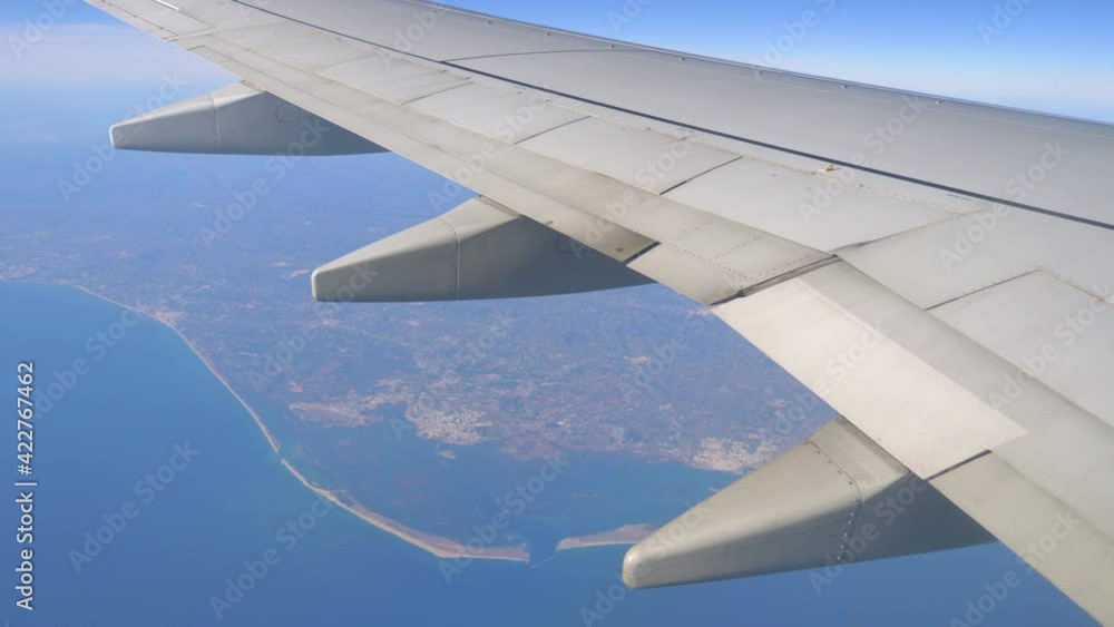 View From Airplane Window at Beautiful ocean and coastline in 4k slow motion 60fps View From Airplane Window at Beautiful ocean and coastline in 4k slow motion 60fps