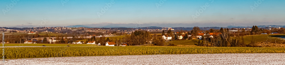 Beautiful winter landscape with a far view of the famous Schweiklberg monastery seen from near Aunkirchen, Bavaria, Germany
