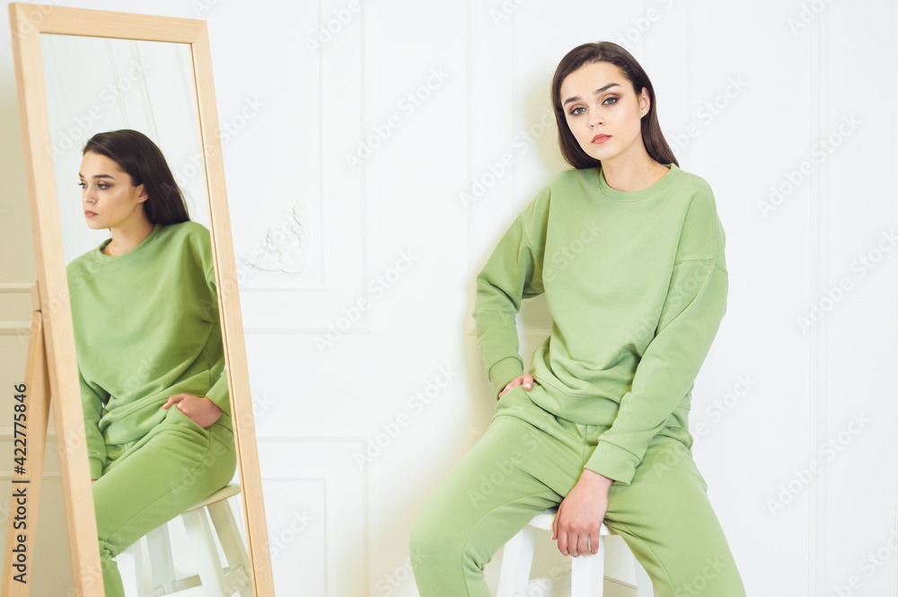 Fashion woman wearing warm hoodie on white background Fashion woman wearing warm hoodie on white background
