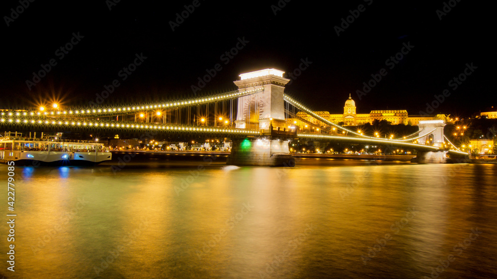 Beautiful night cityscape panorama with stunning illuminated Chain bridge and Buda castle at dawn, Budapest, Hungary, Europe
