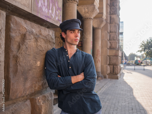 one young man,posing for camera. handsome. Historic part of Belgrade, Serbia. photo