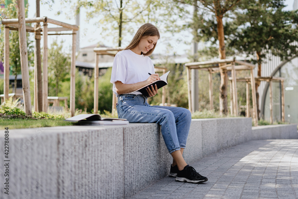 Young academy student girl preparing homework for classes Young academy student girl preparing homework for classes