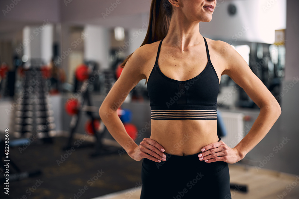 Close up of sportswoman demonstrating her slim body
