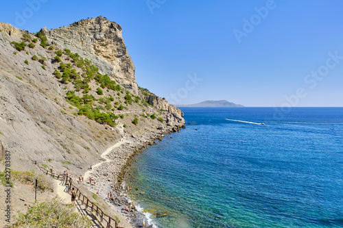 Crimean peninsula. People walk along the tourist route Golitsyn Trail. Botanical reserve New World.