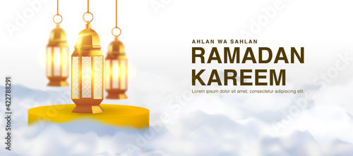 Ahlan wa Sahlan Ramadan Kareem means welcome ramadan. Wallpaper design template with 3d illustration of lantern surrounding in clouds, happy muslim holiday background in gold color. photo