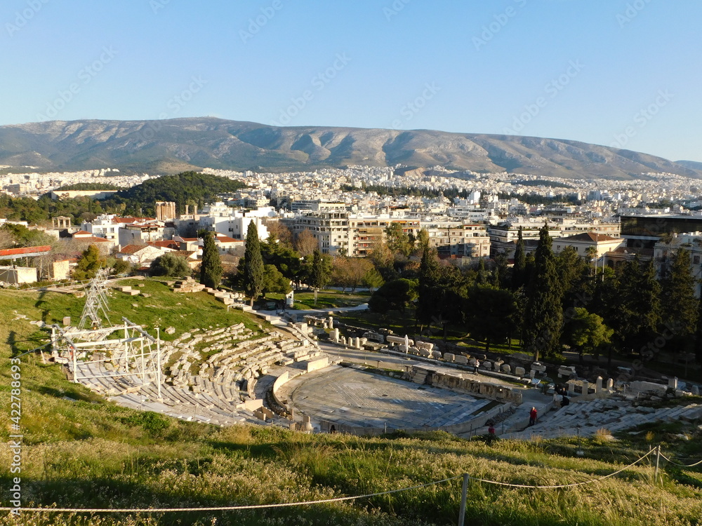 Obraz premium January 2019, Athens, Greece. View of the ancient theater of Dionysus, on the south slope of the Acropolis, and the city