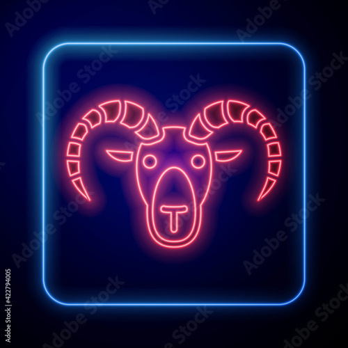 Glowing neon Head of goat or ram icon isolated on blue background. Mountain sheep. Animal symbol. Vector