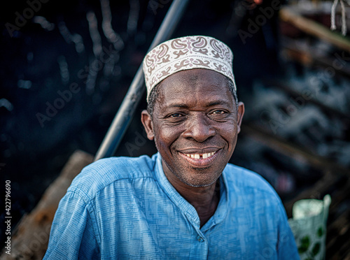 Senior man sitting on coast smiling nice with hat , High quality photo photo