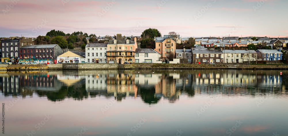 Scenic view of the harbor of Kinsale in the county of Cork, Ireland with low tide at sunset