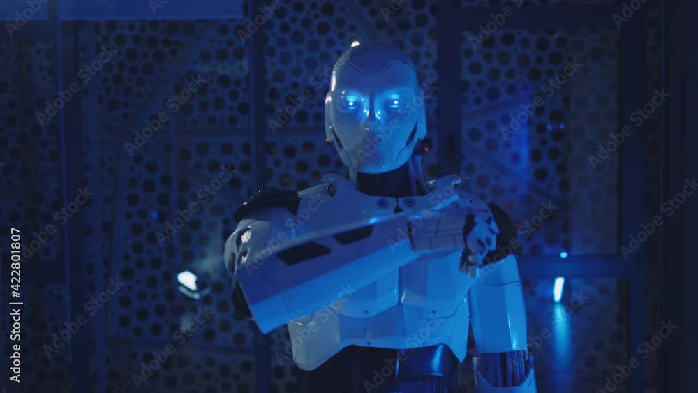 Futuristic humanoid robot moves its head, eyes look at camera. Artificial intelligence. Innovation, engineering, digital, communication, tech, electronic, cyber, high-tech. Slow motion Futuristic humanoid robot moves its head, eyes look at camera. Artificial intelligence. Innovation, engineering, digital, communication, tech, electronic, cyber, high-tech. Slow motion