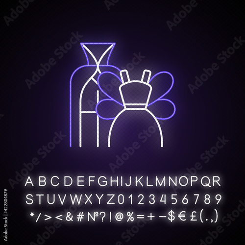 Theme party neon light icon. Vampire, magician, fairy costumes for children. Dressing for kid. Outer glowing effect. Sign with alphabet, numbers and symbols. Vector isolated RGB color illustration