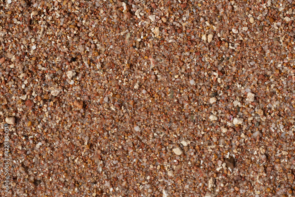texture of small stones and sand. Background from beach pebbles. View from above. blank for text. High quality photo texture of small stones and sand. Background from beach pebbles. View from above. blank for text. High quality photo
