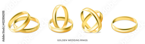 Set of gold engagement rings isolated on white background