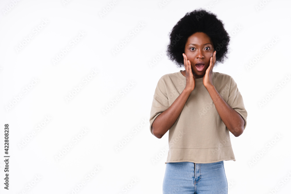 Surprised african-american teenager girl isolated over white background Surprised african-american teenager girl isolated over white background