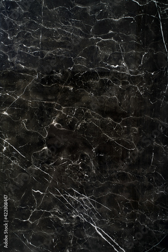 Ceramic porcelain stoneware tile texture or pattern. Natural stone black color with veining