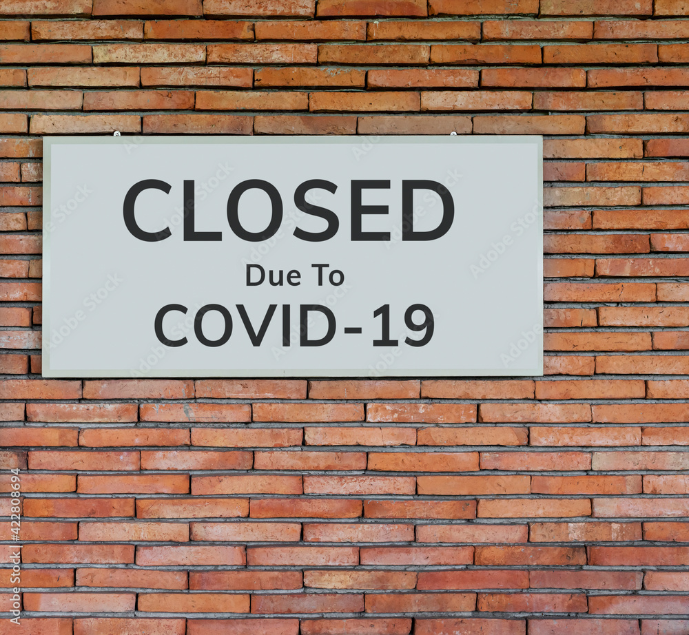  closed sign outside a restaurant, store, office or other outdoor