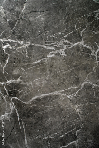 Ceramic porcelain stoneware tile texture or pattern. Natural stone black color with veining