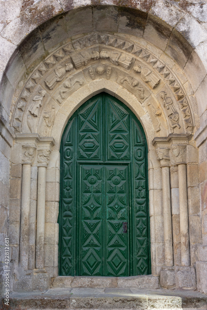 green colored door of a church in Galicia