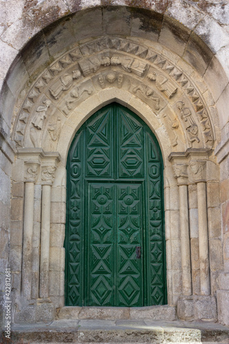green colored door of a church in Galicia © loopneo