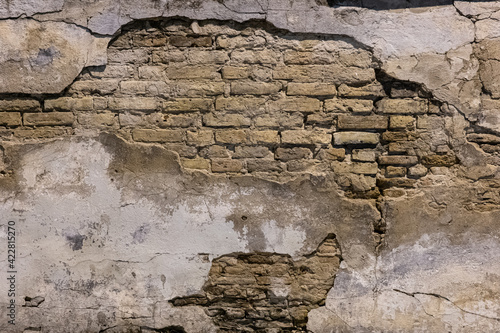 Принти на полотні Old brick wall with modern plaster falling apart