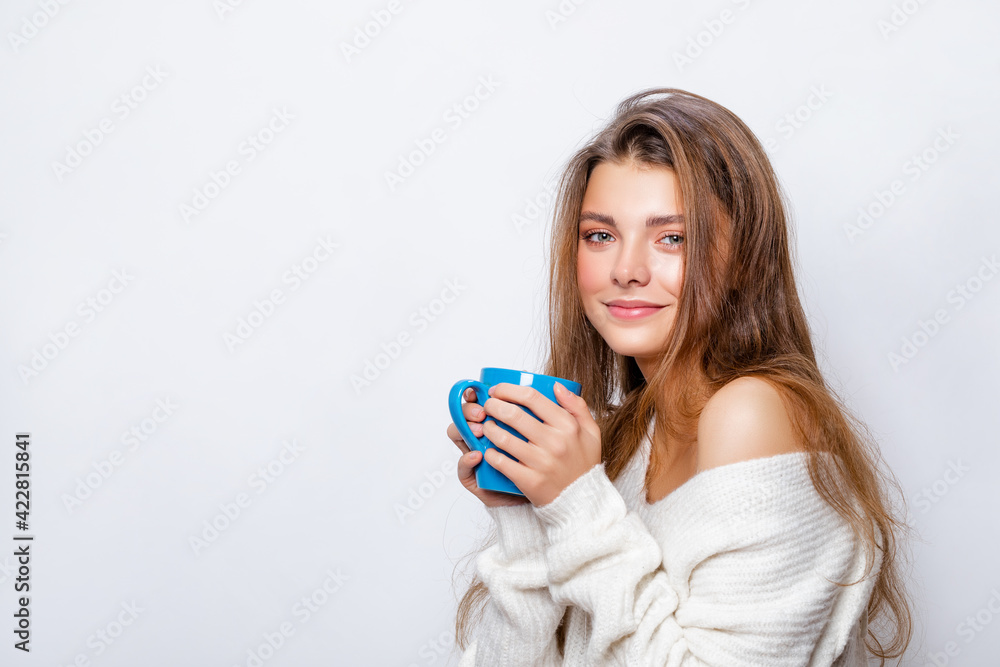 Happy Girl Smile drinks her aromatic coffee and looks at the camera. Relaxed and Carefree white Woman. Portrait. Happy Girl Smile drinks her aromatic coffee and looks at the camera. Relaxed and Carefree white Woman. Portrait.