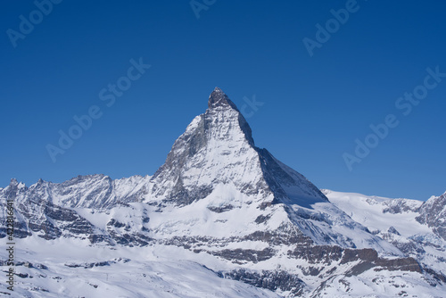 Beautiful winter mountain panorama with famous peak Matterhorn (4478m) seen from Gornergrat, Zermatt, Switzerland. Photo taken March 23rd, 2021. photo