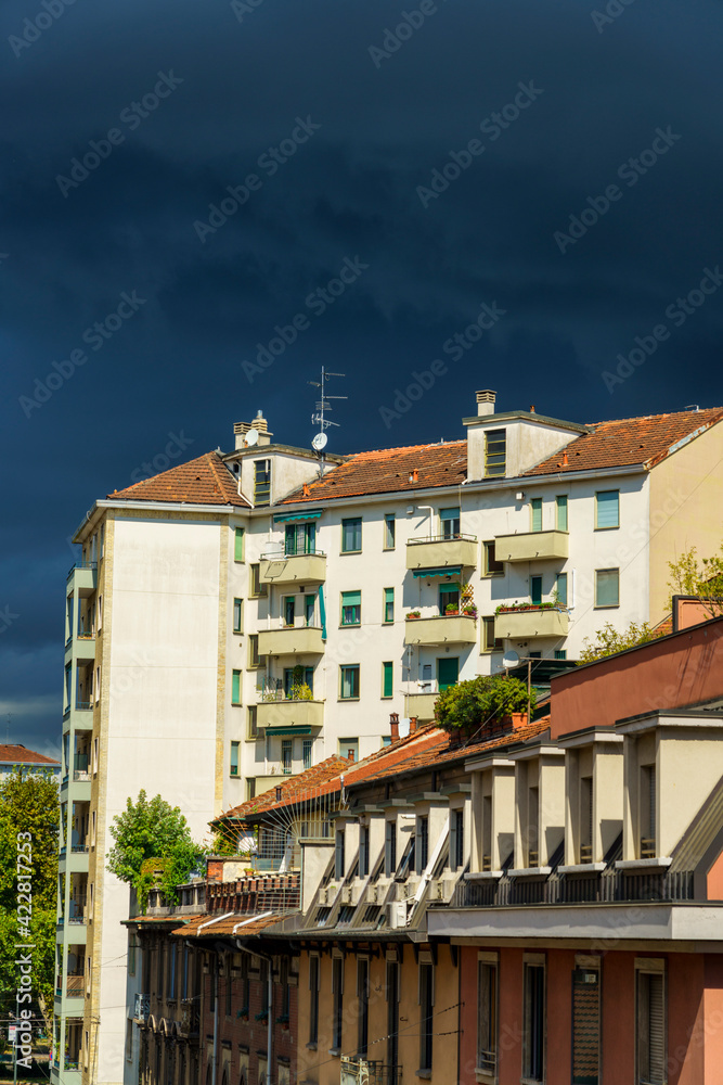 Buildings of Milan with a storm coming