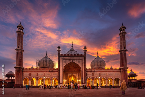 Jama Masjid was originally called Masjid-i-Jahan Numa, 'World-reflecting Mosque', built by Emperor Shah Jahan. It is large mosque constructed with red sandstone & white marble at Delhi, India. photo