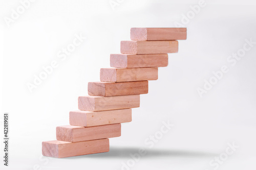 Career promotion concept .Wooden bars stacked in the form of steps 