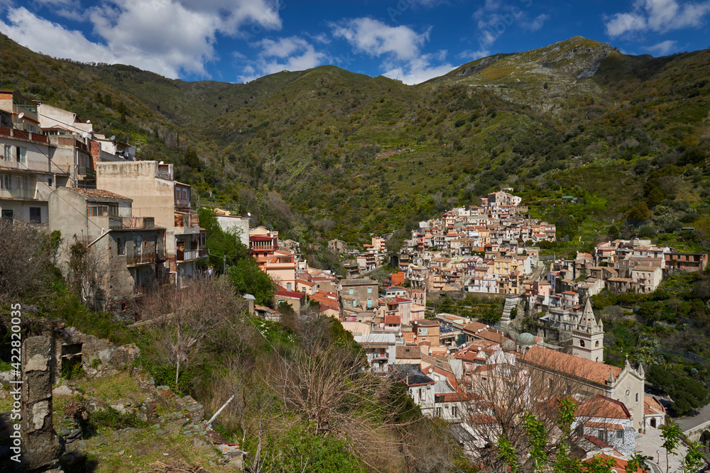 small town in eastern Sicily located between the Peloritani mountains on the east coast, between green valleys and the Ionian sea of the Strait of Messina