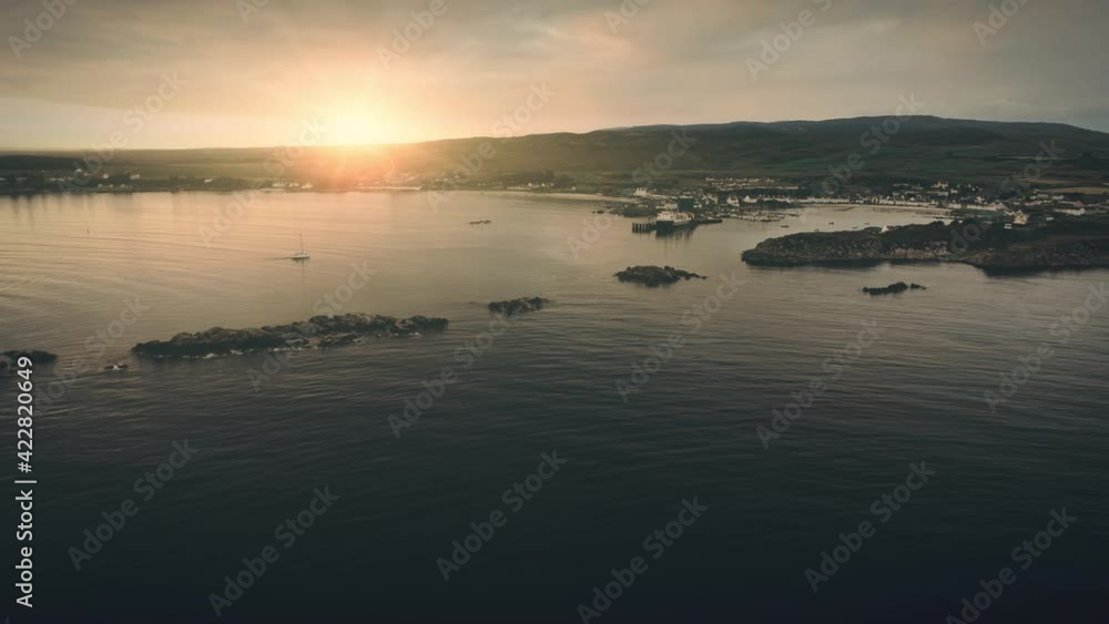 Sunset seascape of ocean bay at island aerial. Nobody nature landscape. Sailboats at sea. Cottages, lodges at mountain shore. Water transport at port town. Ships, yachts at harbor. Dramatic drone shot Sunset seascape of ocean bay at island aerial. Nobody nature landscape. Sailboats at sea. Cottages, lodges at mountain shore. Water transport at port town. Ships, yachts at harbor. Dramatic drone shot