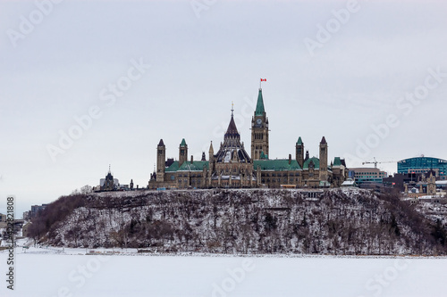 View of Canadian Parliament from the riverbank on a clear winter's day