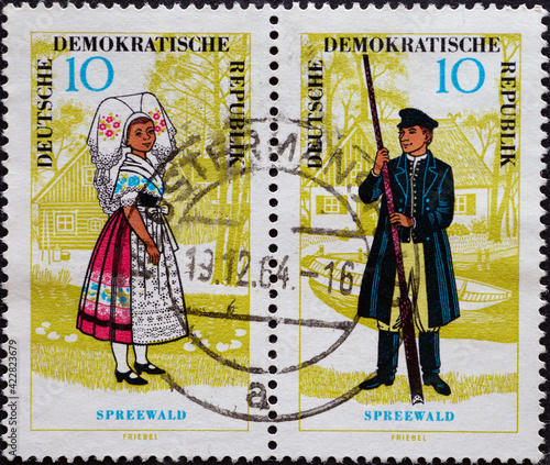 GERMANY, DDR - CIRCA 1964 : a postage stamp from Germany, GDR showing man and woman from the Spreewald in traditional costume. National costumes