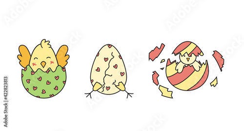 happy little chickens hatching from cracking painted eggs in spring, Easter eggs and chicks, new born baby birds