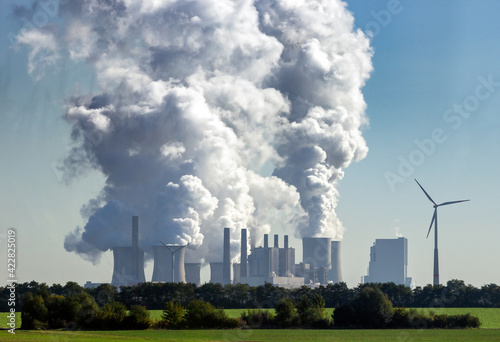 Power plant factory chimney emissions causing air pollution photo