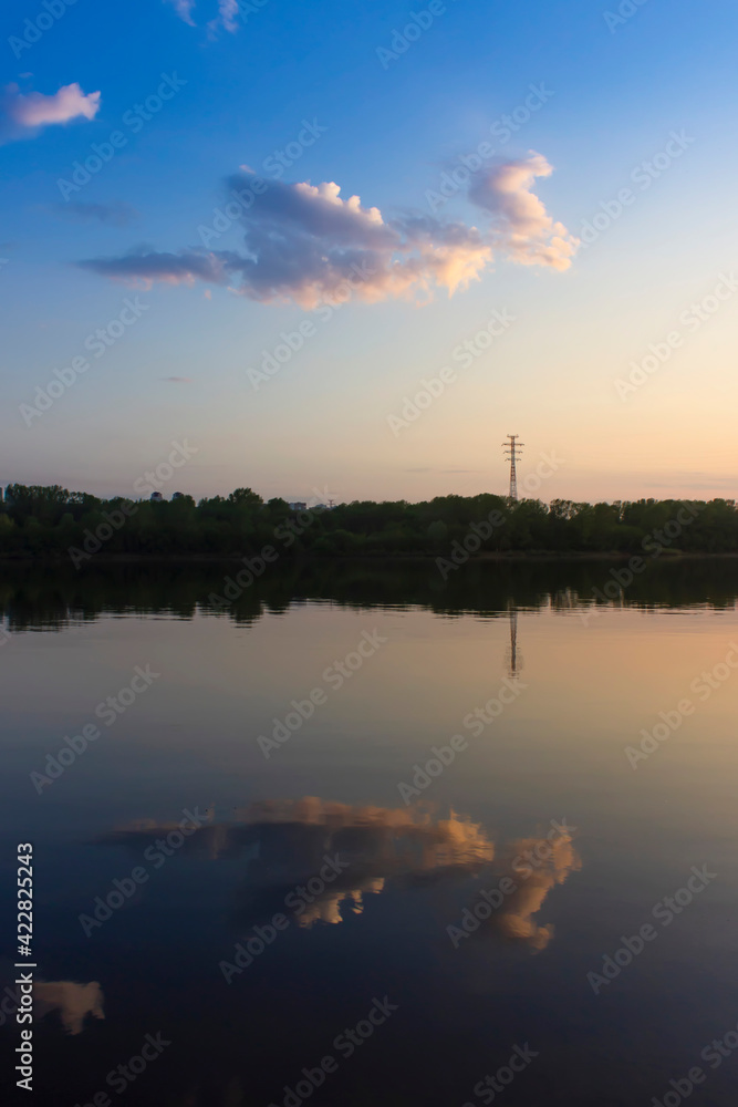 Cloud in the form of a dragon flying over the river. Vertical view.