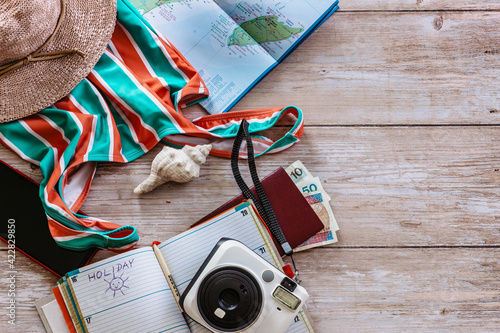 Travel concept banner flat lay.Items for summer vacation: passport,swimsuit,hat,money,Mexico map, camera,diary copy space.Top view holiday concept.Planning fun trip.Travel accessories.Explore world.