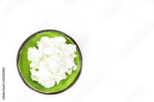 Natural Coconut oil on a white background. Healthy coconut butter. Top view