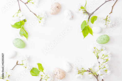 Photography Flat lay easter composition with spring flowers and eggs on white background