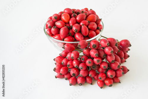 Rose-hips or wild rose berries isolated on a white background.