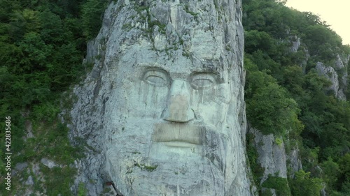 Orsova, Romania, July 30, 2019. Dolly zoom on Decebalus sightseeing, famous Romanian landmark rock sculpture, colossal carving of the last king of Dacia, Mehedinti County. Beautiful places to travel photo