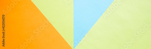 Color papers geometry flat composition background with green, orange and blue tones.New Minimal Flat design. Colorful new Paper modern background. Bright colors for fresh and modern graphics.