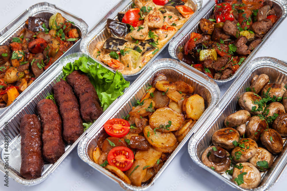 Business lunch in eco plastic container ready for delivery.Top view. Office Lunch boxes with food ready to go. Food takes away. Catering, brakfast.