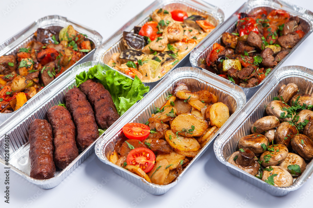 Business lunch in eco plastic container ready for delivery.Top view. Office Lunch boxes with food ready to go. Food takes away. Catering, brakfast.