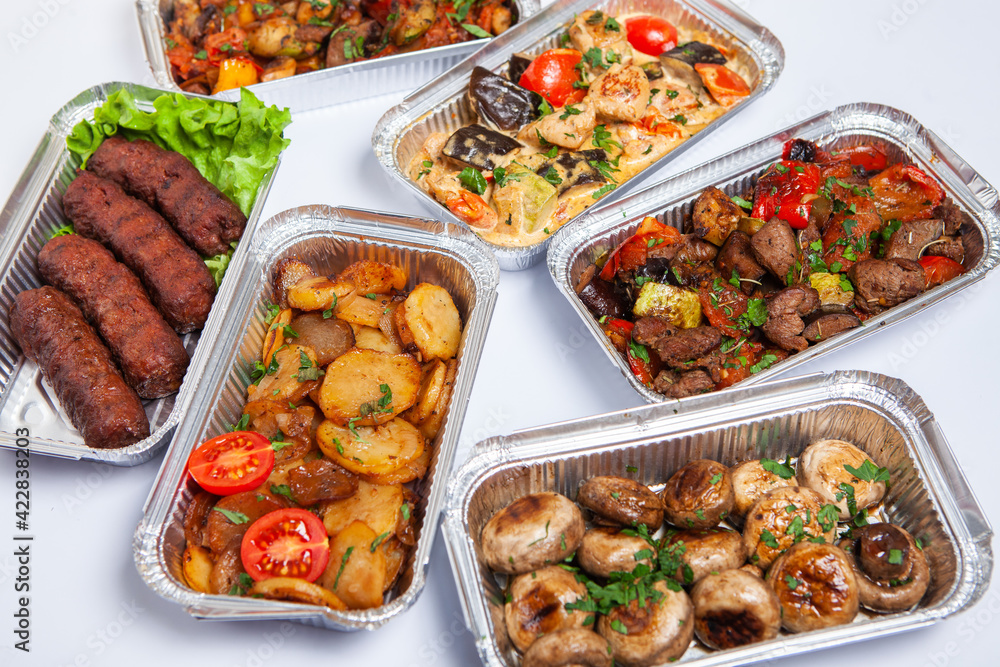 Business lunch in eco plastic container ready for delivery.Top view. Office Lunch boxes with food ready to go. Food takes away. Catering, brakfast. Business lunch in eco plastic container ready for delivery.Top view. Office Lunch boxes with food ready to go. Food takes away. Catering, brakfast.