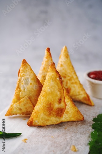 Homemade Samosas - Indian deep fried triangle pastries  selective focus
