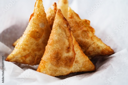 Homemade Samosas - Indian deep fried triangle pastries  selective focus